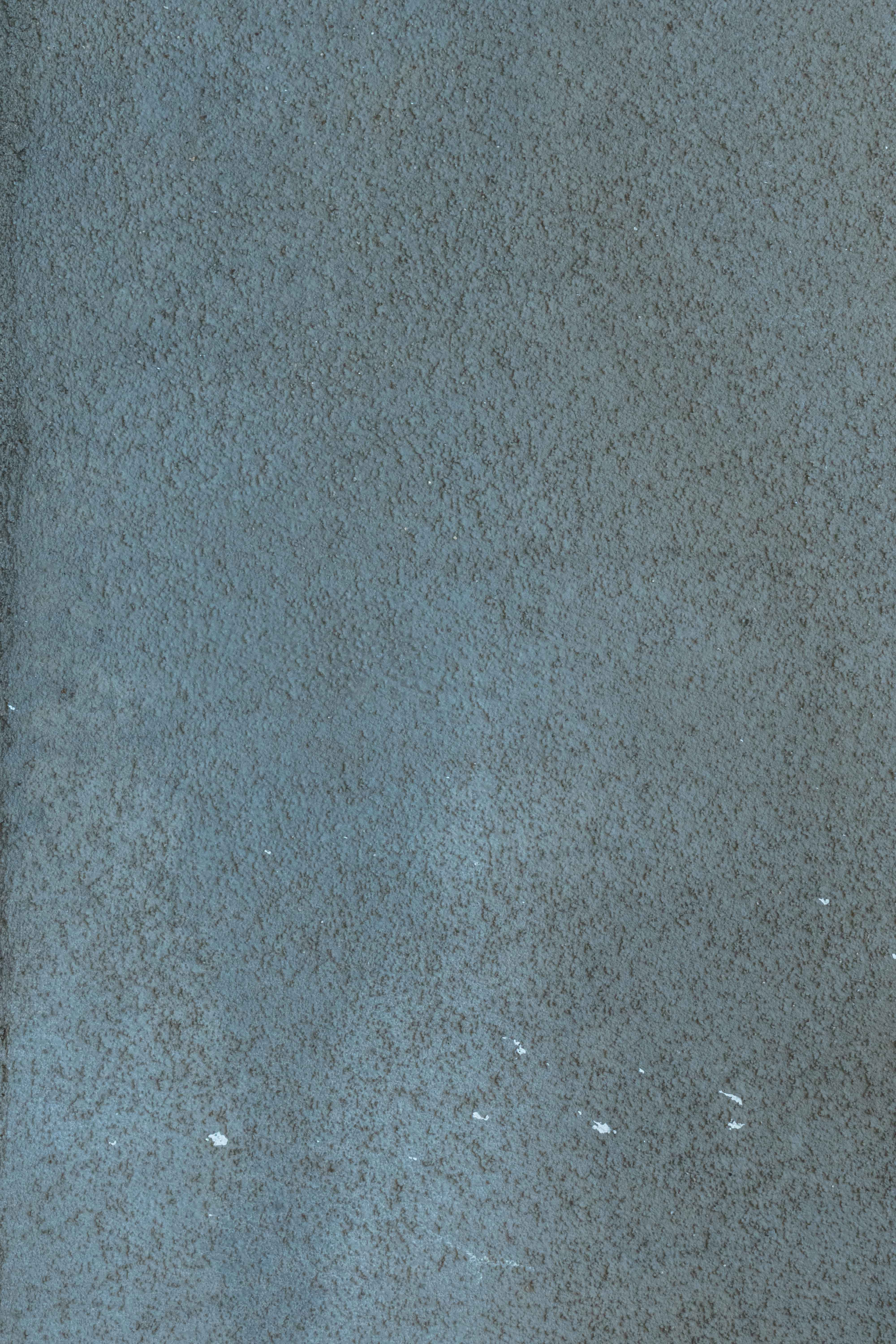 Blue-Gray Textured Stucco Wall Background with Uniform Cement Plaster Finish