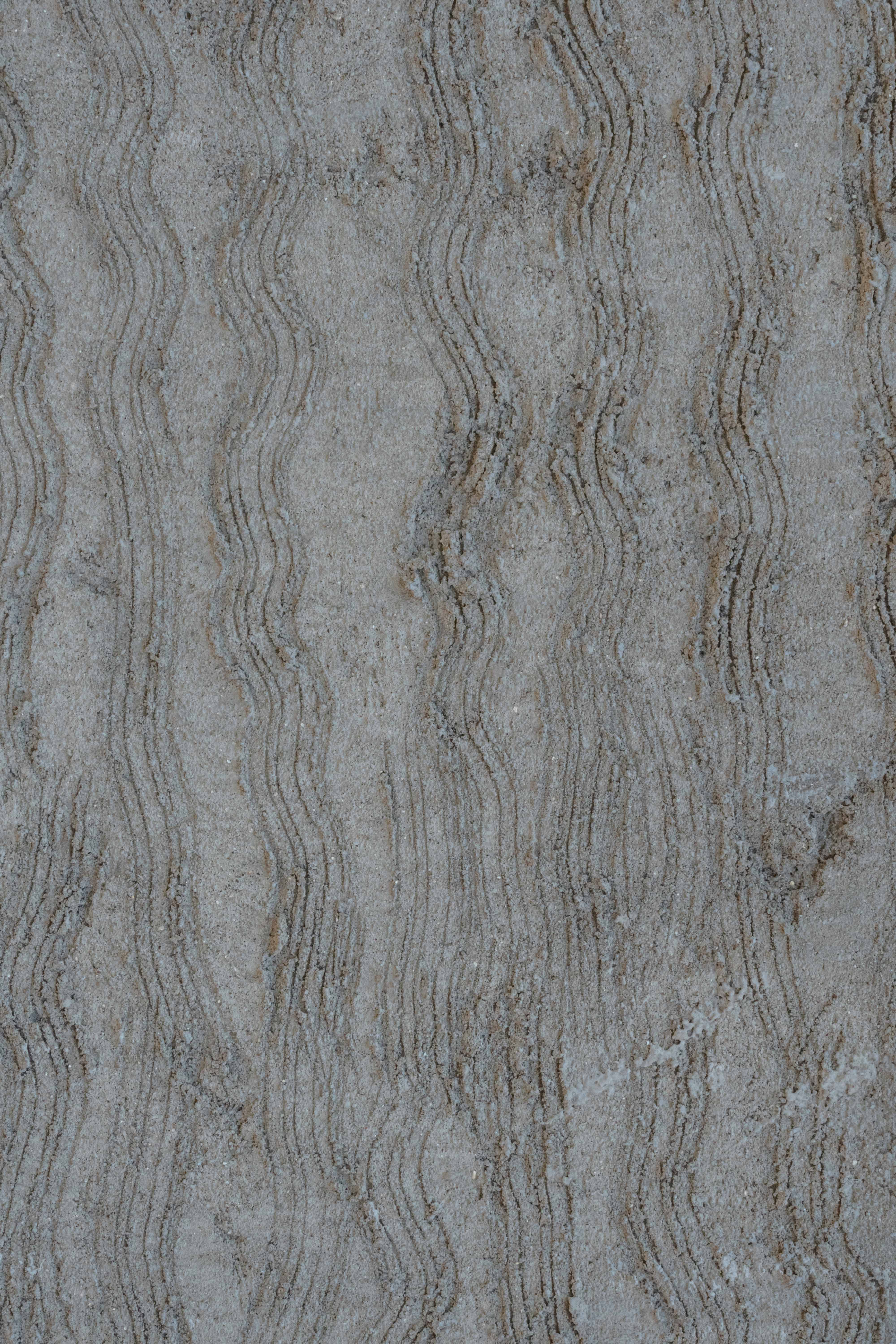 Decorative Gray Cement Plaster Wall with Wavy Comb Texture Pattern