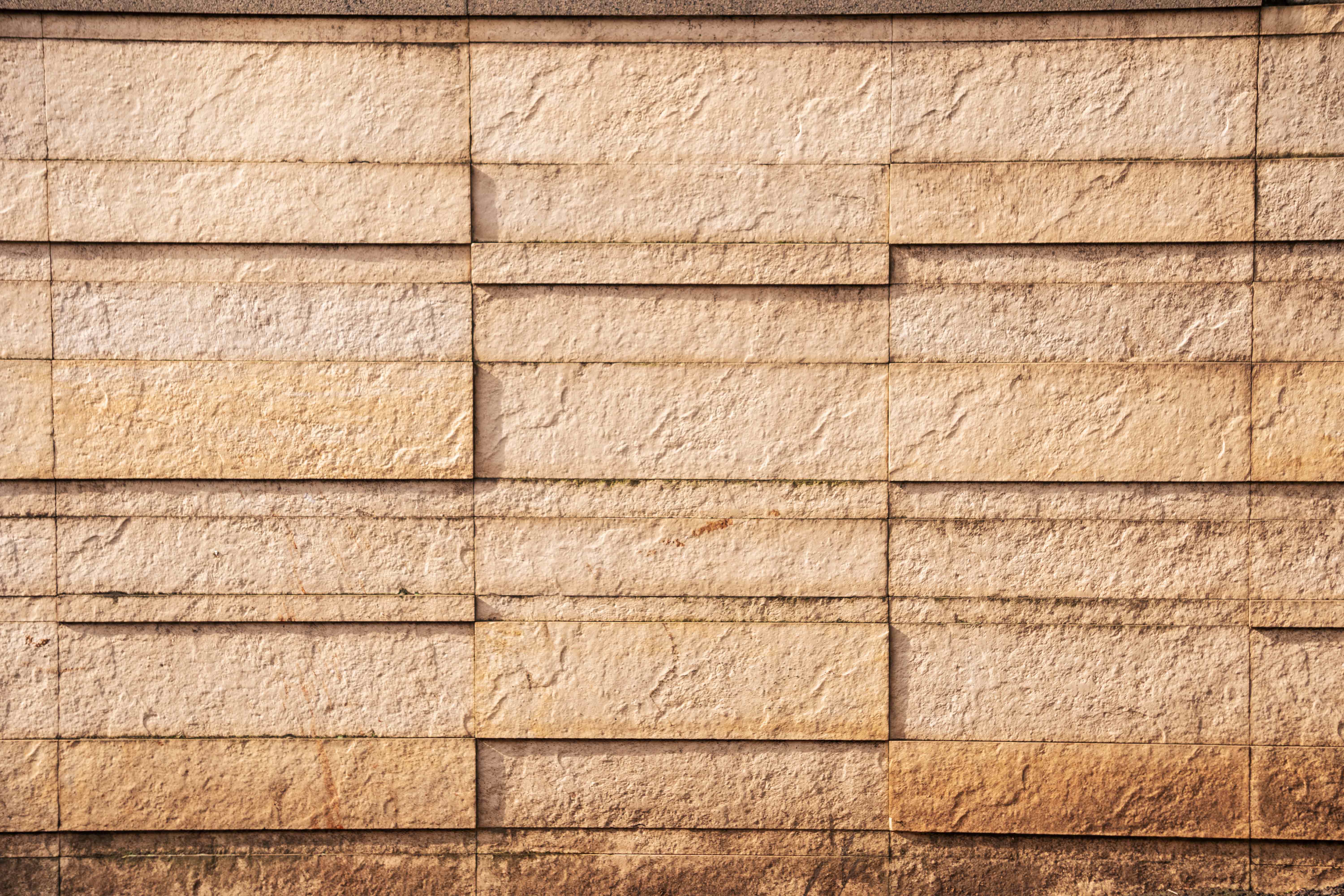 Weathered Beige Limestone Block Wall Texture