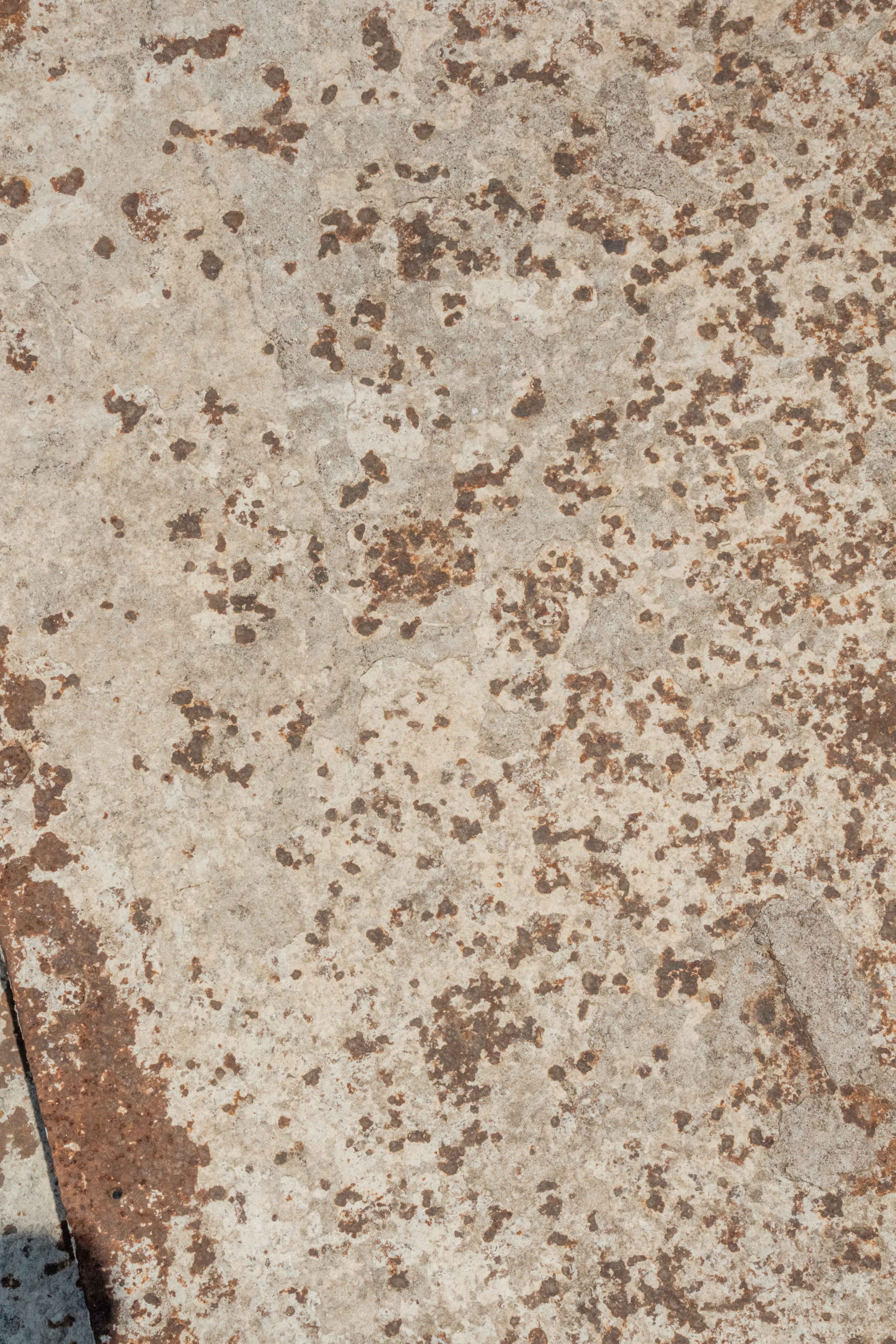 Weathered metal surface with natural rust stains and concrete marks in 6K resolution